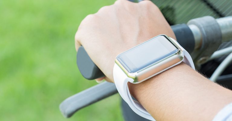 closeup hand wear smart watch riding bicycle exercise sport