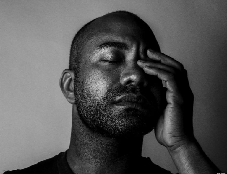 Portrait of a man with his eyes closed